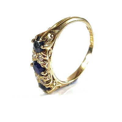 Lot 16 - An early 20th century 18ct diamond and sapphire seven stone ring