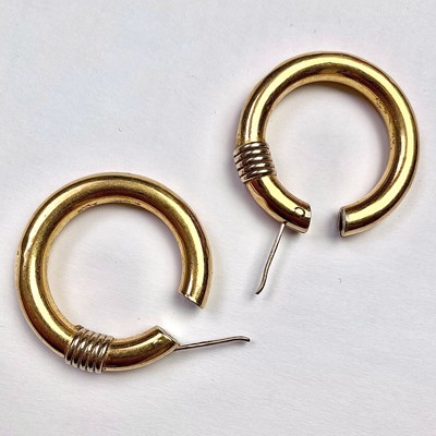 Lot 630 - A pair of 18ct gold large hollow hoop earrings,...