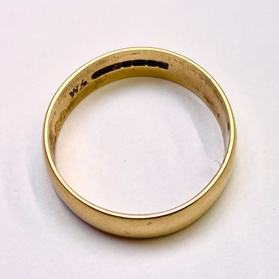 Lot 689 - An 18ct hallmarked gold band ring, Birmingham...