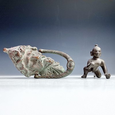 Lot 638 - A cast bronze door knocker modelled as the...