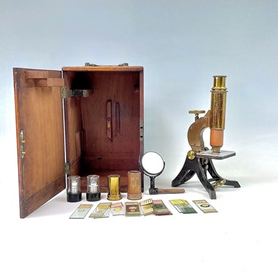 Lot 54 - A brass and lacquered microscope, circa 1900,...