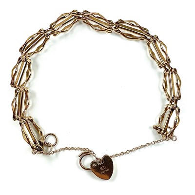 Lot 173 - A 9ct gold three bar gatelink bracelet with...