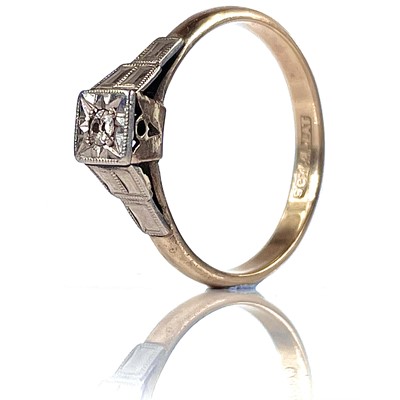 Lot 35 - A 9ct and platinum single small diamond set...
