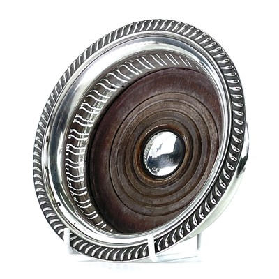 Lot 47 - A modern silver wine coaster by Harrods, with...