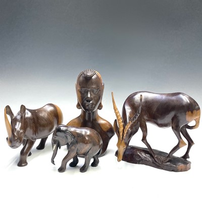 Lot 207 - An African carved ironwood rhino together with...