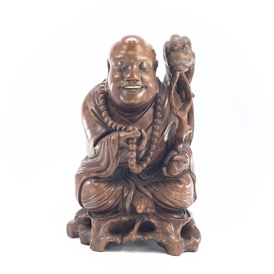 Lot 279 - A large Chinese carved wood model of buddah,...