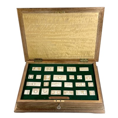 Lot 162 - A 1977 cased set of 25 silver British postage...