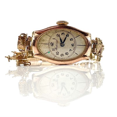 Lot 334 - A 1930's 9ct ladies manual wind bracelet...