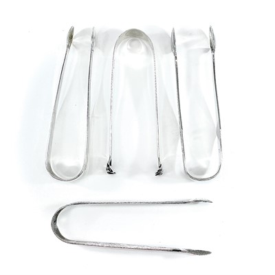 Lot 127 - Three Georgian silver sugar nips, weight 2.86...