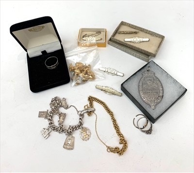 Lot 2680 - A gilt charm bracelet, gilt charms, A St...