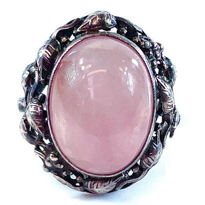 Lot 142 - A silver Arts & Crafts rose quartz set ring,...