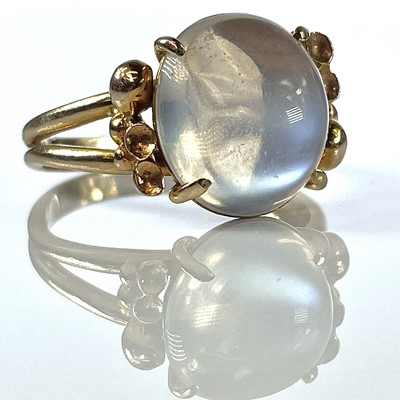Lot 211 - A stylish 14K moonstone set cocktail ring, the...