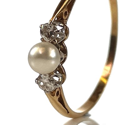 Lot 24 - An 18ct diamond and pearl set three stone ring,...