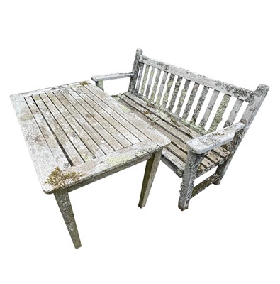 Lot 602 - A teak slatted garden bench height 89cm width...