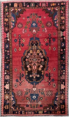 Lot 1236 - A North West Persian rug, the madder field...