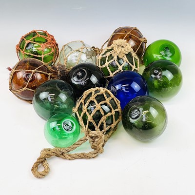 Lot 93 - A collection of glass floats including blue,...