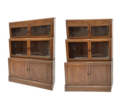 Lot 3019 - A pair of oak sectional bookcases, the 1930s,...