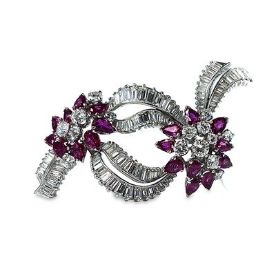 Lot 124 - A stylish mid-century diamond and ruby brooch,...