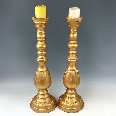 Lot 150 - A pair of large gold painted candle stands,...