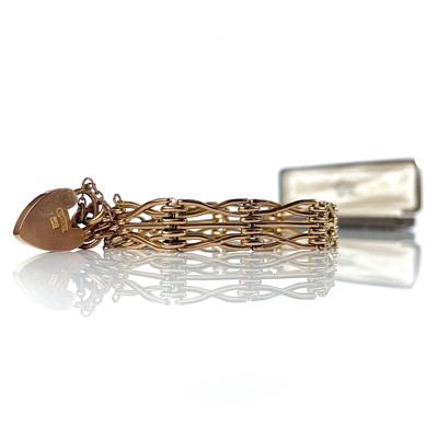 Lot 31 - A 9ct five bar gatelink bracelet with 9ct...
