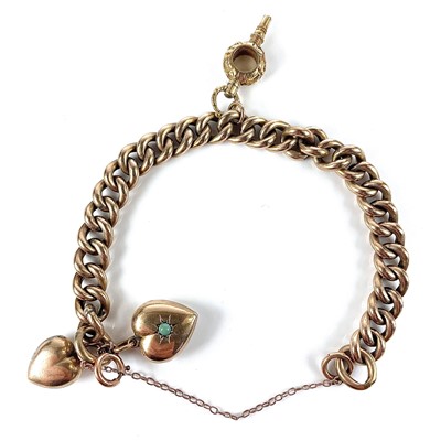 Lot 134 - A 9ct curb link bracelet, attached with two...