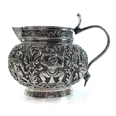 Lot 1005 - An Indian Madras silver jug, circa 1900, the...