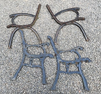 Lot 607 - A pair of cast iron bench ends together with...