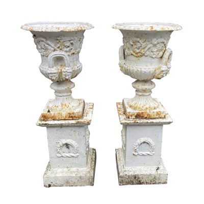 Lot 611 - A pair of Victorian cast iron twin handled...