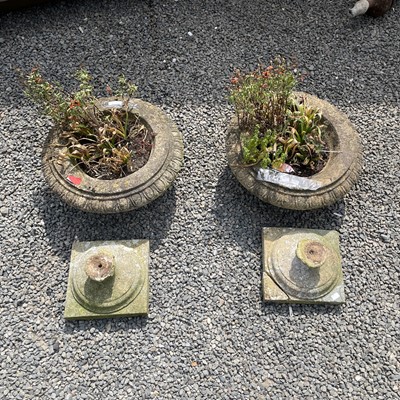 Lot 616 - A pair of reconstituted stone urns on separate...