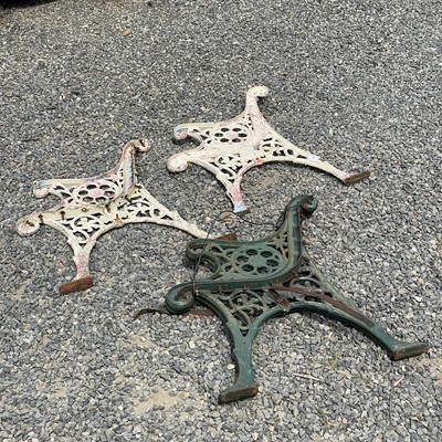 Lot 621 - A pair of cast iron bench ends together with...