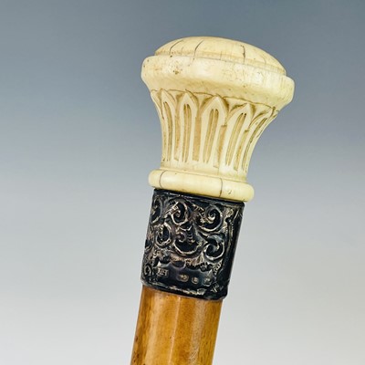Lot 175 - A late Victorian cane, with turned ivory knop...