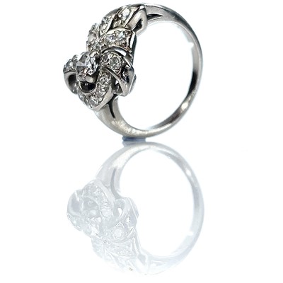 Lot 110 - A 14k white gold diamond dress ring of floral...