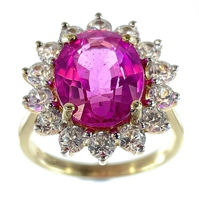 Lot 19 - A 9ct large pink sapphire cubic zirconia set...