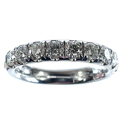 Lot 197 - A platinum diamond set half eternity ring, the...