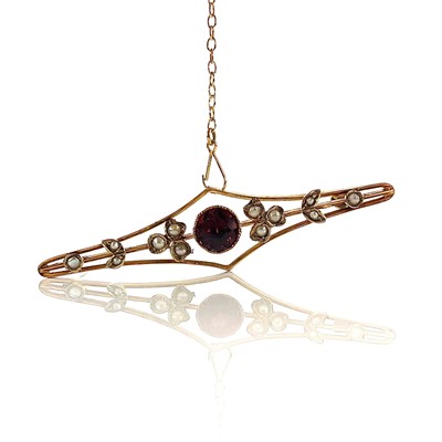 Lot 26 - A 9ct gold garnet and seed pearl set bar...