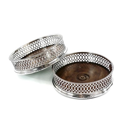 Lot 62 - A good pair of George III silver wine coasters...