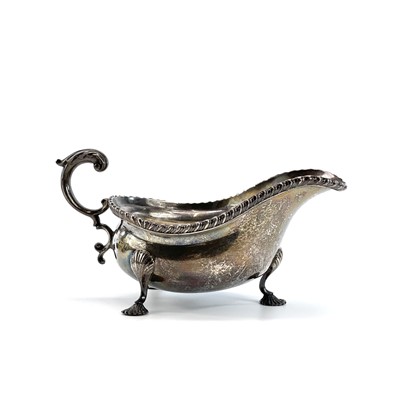 Lot 146 - An edwardian silver Georgian style sauce boat...