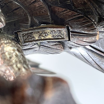 Lot 24 - A Japanese silvered bronze Okimono of a hawk...