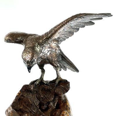 Lot 24 - A Japanese silvered bronze Okimono of a hawk...