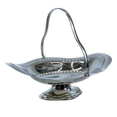 Lot 190 - A George V silver pedestal swing handled bread...