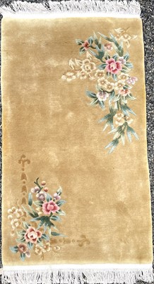Lot 1237 - A Chinese rug, mid 20th century, with two...