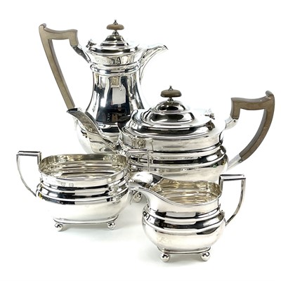 Lot 24 - A George VI silver four piece tea set by Lowe Chester.