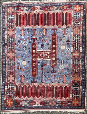 Lot 1246 - A Turkish carpet, the light blue field with a...