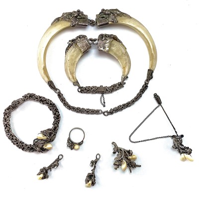 Lot 245 - A collection of stag's tooth white metal...