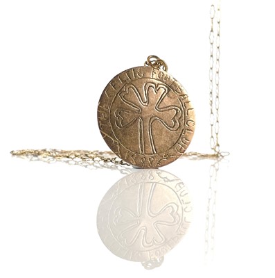 Lot 52 - A gold pendant crudely engraved with The...