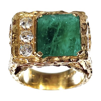 Lot 169 - A 1970's 18ct gold emerald and diamond set...