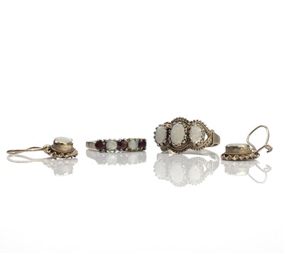 Lot 235 - A 9ct 1970's white opal three stone ring, size...