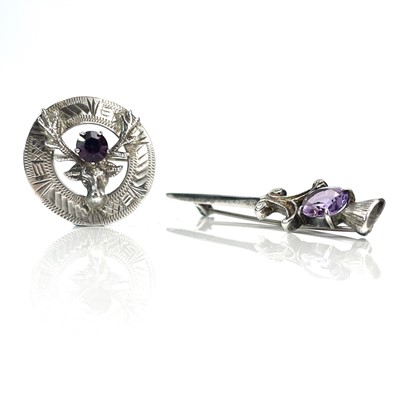 Lot 210 - Two Scottish silver brooches set with amethyst,...