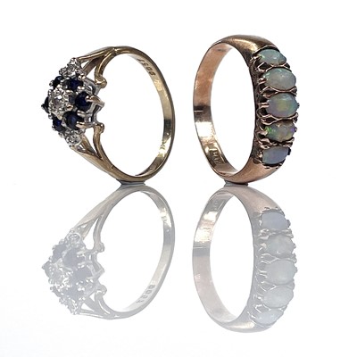 Lot 185 - A 9ct diamond and sapphire nine stone cluster...