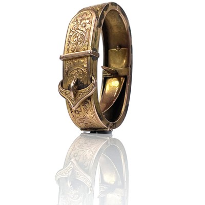 Lot 118 - A 9ct rose gold scarf clip, foliate engraved...